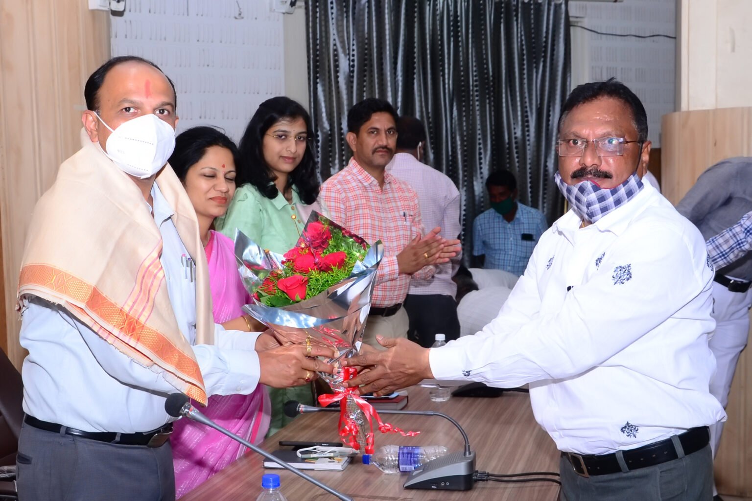 Officials attending a gathering for community service.