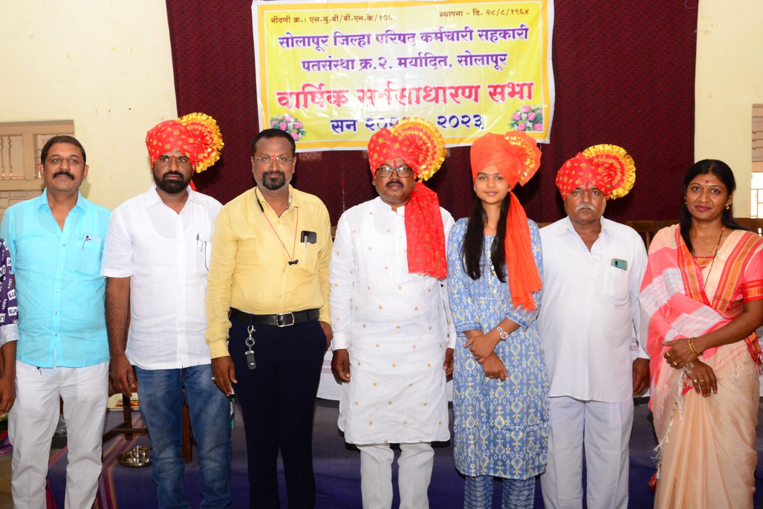 Officials presenting awards during a formal gathering.